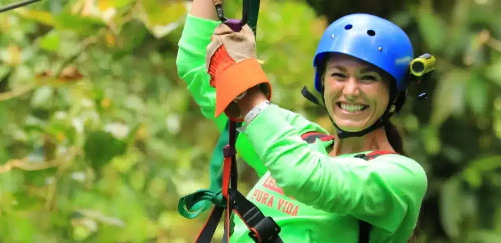 A girl in cloud forest zip line in Monteverde Costa Rica