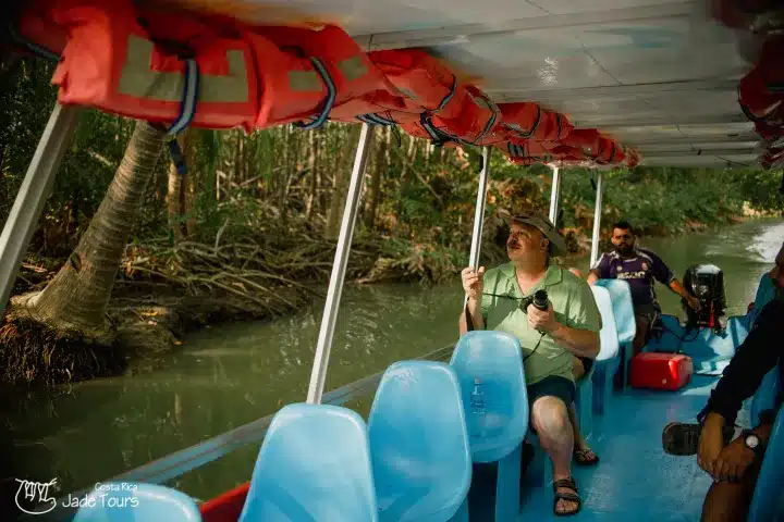 a group of people on a boat in the water