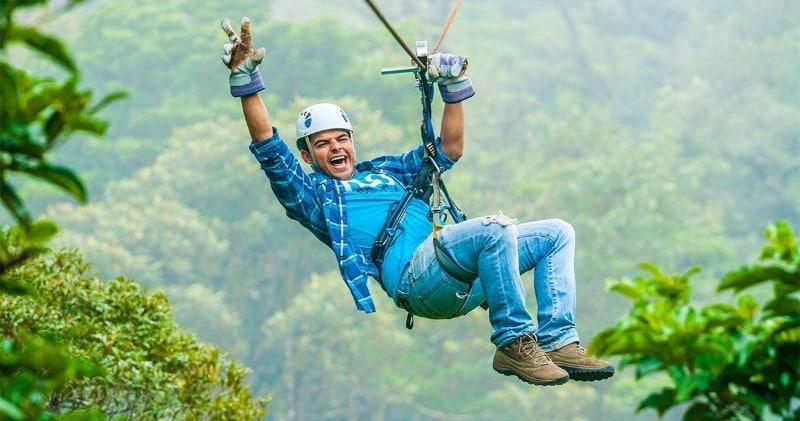 A man doing ziplines in Monteverde Costa Rica