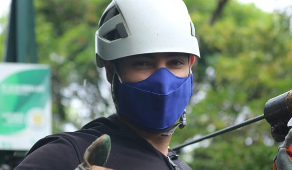 a young boy wearing a helmet ready to zipline