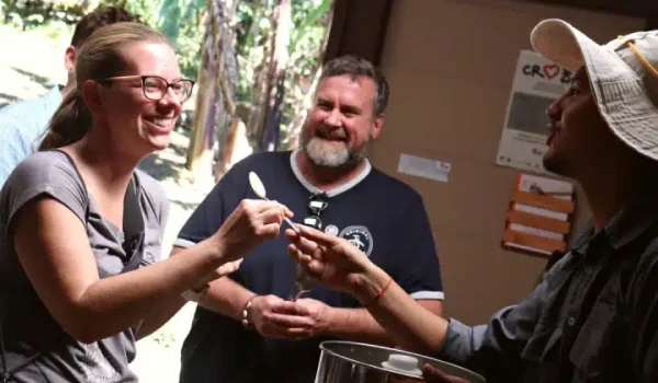 a group of people tasting homemade chocolate