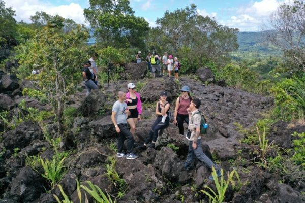 a couple of people that are standing in a garden