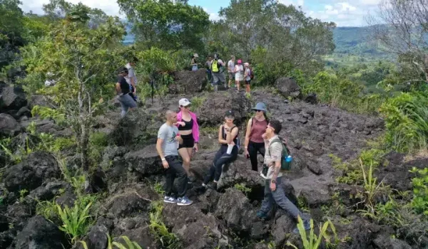 a couple of people that are standing in a garden