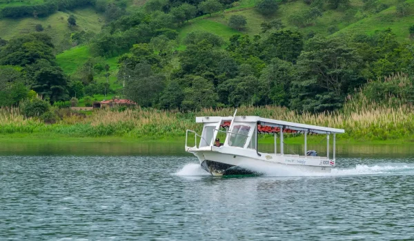 A boat going through Arenal Lake