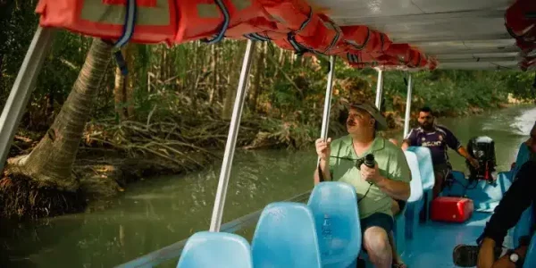 a group of people on a boat in the water