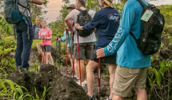 a couple of people that are standing in a garden