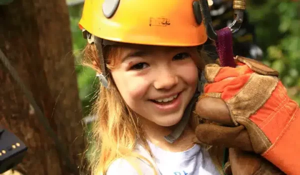 A kid wearing a zipline hat at Selvatura Park